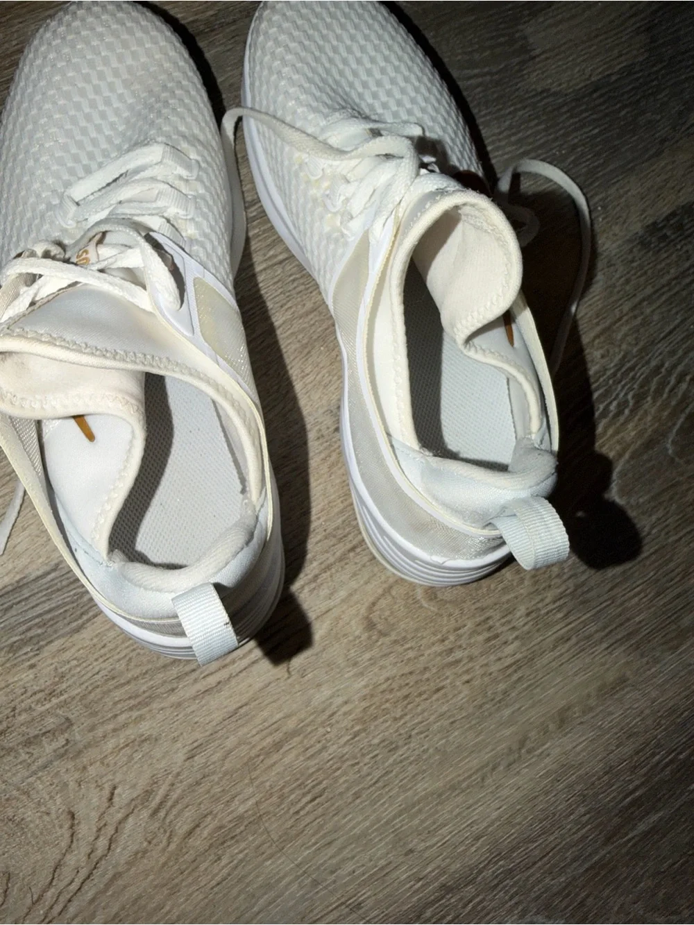Nike Women's White Athletic Sneakers with Gold Swoosh